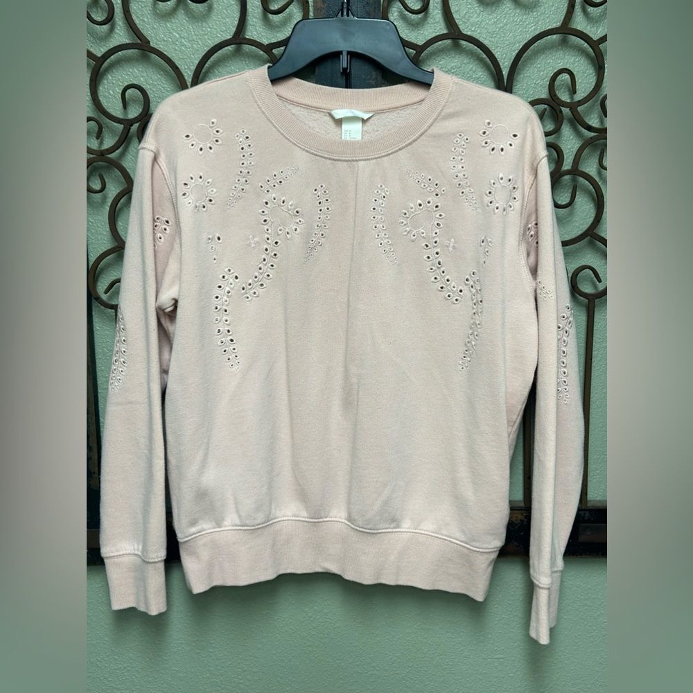 H&M pink sweatshirt with eyelet all over design
